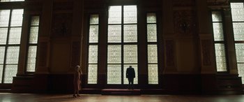 Movie still from “Churchill” (2017), directed by Jonathan Teplitzky – Two people are standing in front of a large window; Extreme Wide shot, Low angle