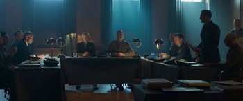 Movie still from “Churchill” (2017), directed by Jonathan Teplitzky – A group of men sitting at a table in front of a window; Wide shot, Low angle