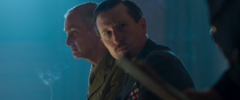 Movie still from “Churchill” (2017), directed by Jonathan Teplitzky – Two men in military uniforms are standing next to each other; Close Up shot, Low angle