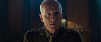 Movie still from “Churchill” (2017), directed by Jonathan Teplitzky – An older man in a military uniform stares at the camera; Close Up shot, Low angle