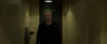 Movie still from “Churchill” (2017), directed by Jonathan Teplitzky – An older woman standing in a dark hallway; Medium shot, Low angle