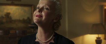 Movie still from “Churchill” (2017), directed by Jonathan Teplitzky – An older woman wearing a pearl necklace looking upward; Close Up shot, Low angle