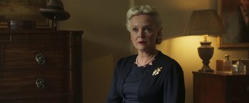 Movie still from “Churchill” (2017), directed by Jonathan Teplitzky – An older woman wearing a black dress and a pearl necklace; Close Up shot, Low angle