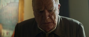 Movie still from “Churchill” (2017), directed by Jonathan Teplitzky – An older man with a sad look on his face; Close Up shot, Over the shoulder angle