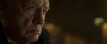 Movie still from “Churchill” (2017), directed by Jonathan Teplitzky – An older man with a serious look on his face; Close Up shot, Low angle
