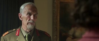 Movie still from “Churchill” (2017), directed by Jonathan Teplitzky – An older man in uniform looking at a mirror; Close Up shot, Low angle