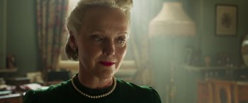 Movie still from “Churchill” (2017), directed by Jonathan Teplitzky – An older woman wearing a green shirt and a pearl necklace; Close Up shot, Low angle