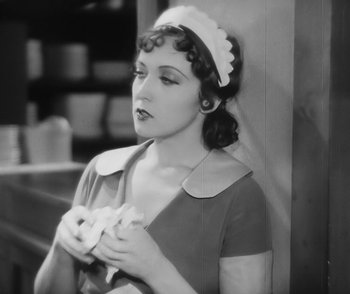 Movie still from “City Girl” (1930), directed by F.W. Murnau – A woman in a maid's outfit holding a napkin; Close Up shot, High angle