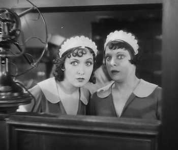 Movie still from “City Girl” (1930), directed by F.W. Murnau – A pair of women are looking in the mirror; Medium shot, Low angle
