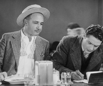 Movie still from “City Girl” (1930), directed by F.W. Murnau – A man and a woman sitting at a dinner table; Medium shot, Low angle