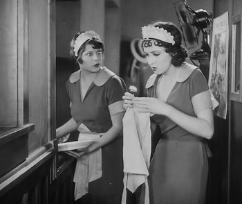 Movie still from “City Girl” (1930), directed by F.W. Murnau – Two young women are looking in the mirror; Medium shot, Low angle
