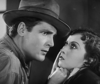 Movie still from “City Girl” (1930), directed by F.W. Murnau – A man and a woman standing next to each other in front of a wall; Close Up shot, High angle