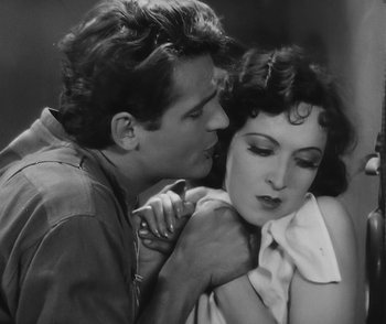 Movie still from “City Girl” (1930), directed by F.W. Murnau – A man kissing a woman on the cheek in a black and white photo; Close Up shot, High angle