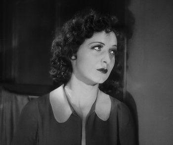 Movie still from “City Girl” (1930), directed by F.W. Murnau – An old photo of a woman looking to her left; Close Up shot, High angle