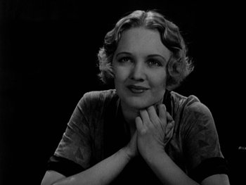 Movie still from “City Lights” (1931), directed by Charles Chaplin – An old photo of a woman posing for a picture; Close Up shot, Low angle