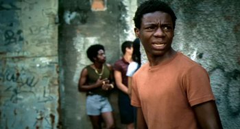 Movie still from “City of God” (2002), directed by Kátia Lund – A group of young men standing next to each other; Close Up shot, Over the shoulder angle