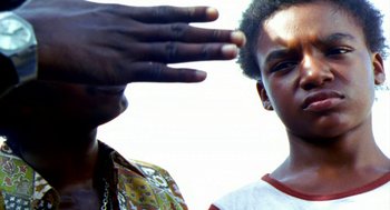 Movie still from “City of God” (2002), directed by Kátia Lund – Two young men standing next to each other; Close Up shot, Low angle