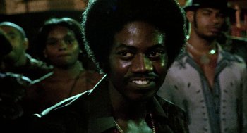 Movie still from “City of God” (2002), directed by Kátia Lund – A person wearing a jacket; Close Up shot, Low angle