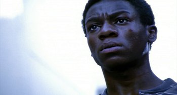 Movie still from “City of God” (2002), directed by Kátia Lund – A person looking up at the sky; Close Up shot, Low angle