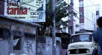 Movie still from “City of God” (2002), directed by Kátia Lund – A truck parked on the side of the street; Wide shot, Low angle