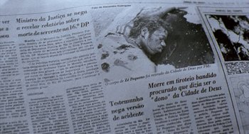 Movie still from “City of God” (2002), directed by Kátia Lund – Image of a newspaper article; Extreme Close Up shot, High angle