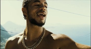Movie still from “City of Men” (2007), directed by Paulo Morelli – A person wearing a necklace; Close Up shot, Low angle