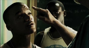 Movie still from “City of Men” (2007), directed by Paulo Morelli – Two young men standing next to each other in a room; Close Up shot, Over the shoulder angle