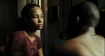 Movie still from “City of Men” (2007), directed by Paulo Morelli – A young woman sitting in front of a mirror looking sad; Close Up shot, Over the shoulder angle