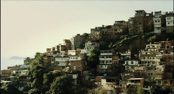 Movie still from “City of Men” (2007), directed by Paulo Morelli – A view of a bunch of buildings on a hill; Extreme Wide shot, Low angle