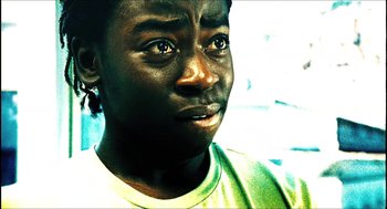 Movie still from “City of Men” (2007), directed by Paulo Morelli – A person with a green shirt; Close Up shot, High angle