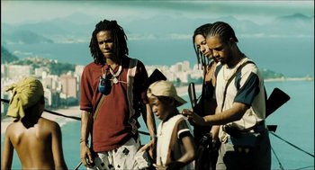 Movie still from “City of Men” (2007), directed by Paulo Morelli – A group of people standing next to each other on top of a building; Medium shot, Low angle