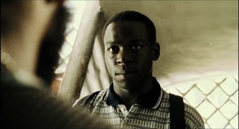 Movie still from “City of Men” (2007), directed by Paulo Morelli – A person wearing a shirt; Close Up shot, Over the shoulder angle