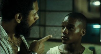 Movie still from “City of Men” (2007), directed by Paulo Morelli – A man pointing at another man in a white shirt; Close Up shot, Low angle