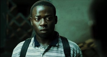 Movie still from “City of Men” (2007), directed by Paulo Morelli – A person with a backpack; Close Up shot, High angle