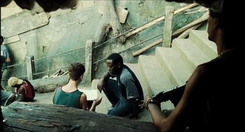 Movie still from “City of Men” (2007), directed by Paulo Morelli – A group of young people sitting on some steps; Medium shot, High angle