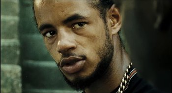 Movie still from “City of Men” (2007), directed by Paulo Morelli – A person with a beard; Close Up shot, Low angle