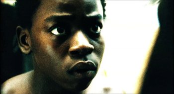 Movie still from “City of Men” (2007), directed by Paulo Morelli – A young man's face; Close Up shot, Low angle