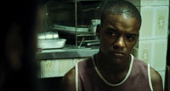 Movie still from “City of Men” (2007), directed by Paulo Morelli – A person in a kitchen; Close Up shot, Low angle