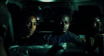 Movie still from “City of Men” (2007), directed by Paulo Morelli – Two men sitting in the back seat of a car at night; Close Up shot, Over the shoulder angle