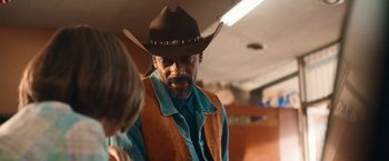 Movie still from “Day Shift” (2022), directed by J.J. Perry – A man wearing a cowboy hat talking to a woman; Close Up shot, Over the shoulder angle