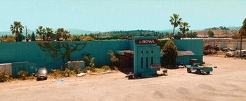 Movie still from “Day Shift” (2022), directed by J.J. Perry – An empty parking lot in an abandoned bowling alley; Extreme Wide shot, High angle