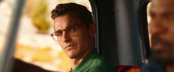 Movie still from “Day Shift” (2022), directed by J.J. Perry – A person wearing glasses; Close Up shot, Over the shoulder angle