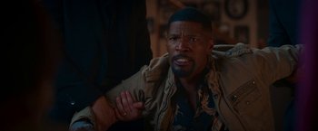 Movie still from “Day Shift” (2022), directed by J.J. Perry – A person with his hand on his shoulder; Medium shot, Over the shoulder angle