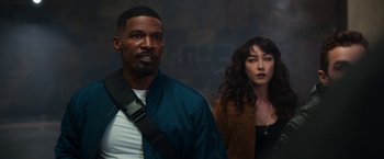 Movie still from “Day Shift” (2022), directed by J.J. Perry – A man and a woman standing next to each other; Medium shot, Low angle