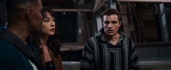 Movie still from “Day Shift” (2022), directed by J.J. Perry – A man and a woman standing next to each other; Medium shot, Over the shoulder angle