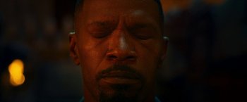 Movie still from “Day Shift” (2022), directed by J.J. Perry – A person with his eyes closed; Extreme Close Up shot, High angle