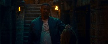 Movie still from “Day Shift” (2022), directed by J.J. Perry – A man and a woman standing next to each other in front of stairs; Close Up shot, Over the shoulder angle