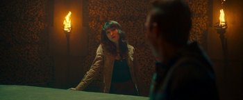 Movie still from “Day Shift” (2022), directed by J.J. Perry – A woman standing in front of a mirror looking at herself in the mirror; Medium shot, Over the shoulder angle