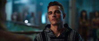 Movie still from “Day Shift” (2022), directed by J.J. Perry – A person wearing a hoodie; Close Up shot, Over the shoulder angle