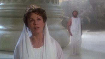 Movie still from “Clash of the Titans” (1981), directed by Desmond Davis – A woman wearing a crown standing next to a man; Close Up shot, Over the shoulder angle